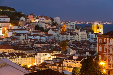 historic mediterranean architecture with church at night with light in Lisboa, Portugalのeditorial素材