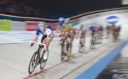 ZURICH-NOV. 30: Professional athlete teams fight for victory at indoor bike challenge Sixday-Nights Zürich 2011 at Zurich Hallenstadion November 30, 2011 in Zurich SUI. のeditorial素材