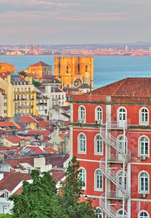 historic mediterranean architecture with church at sunset in Lisboa, Portugalのeditorial素材