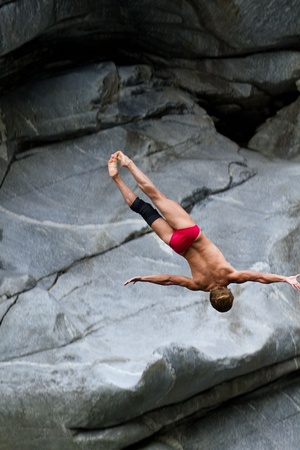 LOCARNO - JULY 23: Cliff diving athlete Anatolii Shabotencko competes in the WHDF European Championship 2011 with dives from up to 20m high at Ponte Brolla July 23, 2011 in Locarno, Switzerland. のeditorial素材