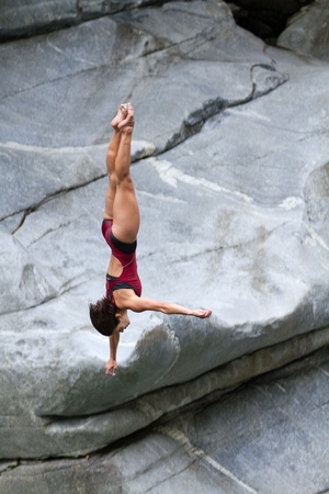 LOCARNO - JULY 23: Cliff diving athlete Anna Bader competes in the WHDF European Championship 2011 with dives from up to 20m high at Ponte Brolla July 23, 2011 in Locarno, Switzerland. のeditorial素材