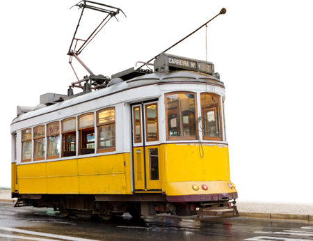 historic classic yellow tram of Lisbon built partially isolated on white, Portugal