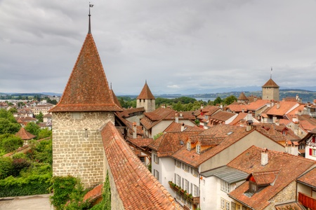 Murten old town with narrow lanes city wall, watch tower  and clay shingle roofs, Switzerlandの写真素材