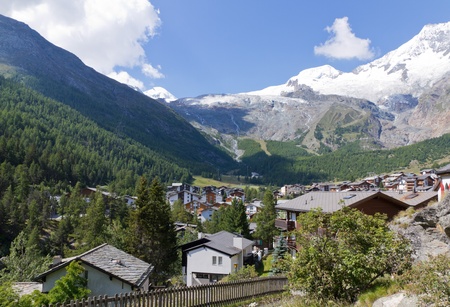 Alpine town of Saas Fee in Saas valley surrounded by high mountains, Vailais, Switzerlandのeditorial素材