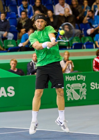 ZURICH, SWITZERLAND-MARCH 24: Carlos Moya plays tennis in final of BNP Paribas Open Champions Tour aganinst Stefan Edberg
in Zurich, SUI on March 24, 2012.  He won the match for medical reasons.
のeditorial素材