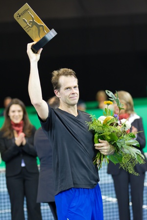 ZURICH, SWITZERLAND-MARCH 24: Stefan Edberg receives a trophy for 2. place in final of BNP Paribas Open Champions Tour aganinst Carlos Moyain Zurich, SUI on March 24, 2012.  のeditorial素材