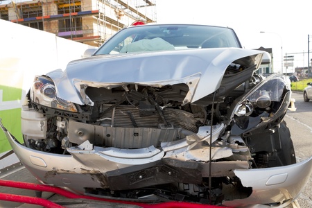 frontal car crash wreck with deployed airbags on trailer to be hauled ofのeditorial素材