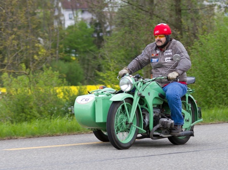 MUTSCHELLEN, SWITZERLAND-APRIL 29: Vintage sidecar motorbike Zündapp KS 600 from 1941 at Grand Prix in Mutschellen, SUI on April 29, 2012.  Invited were vintage sports cars and motorbikes.のeditorial素材