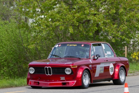 MUTSCHELLEN, SWITZERLAND-APRIL 29: Vintage race touring car BMW 2002 Tii Gruppe 2 from 1968 at Grand Prix in Mutschellen, SUI on April 29, 2012.  Invited were vintage sports cars and motorbikes.のeditorial素材