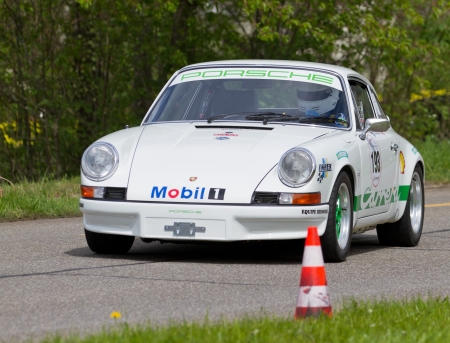 MUTSCHELLEN, SWITZERLAND-APRIL 29: Vintage race touring car Porsche 2.4S from 1972 at Grand Prix in Mutschellen, SUI on April 29, 2012.  Invited were vintage sports cars and motorbikes.のeditorial素材