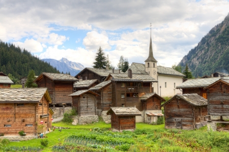 small swiss village settlement Blatten Naters of withered wooden houses and church  in canton Valais  Switzerland の写真素材