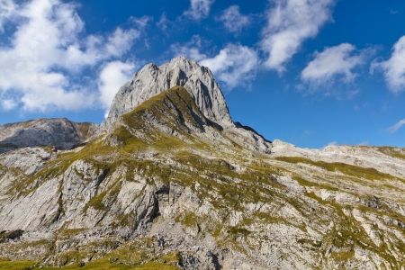 rocky alpine landscape with mountain top in summer, Switzerlandの写真素材