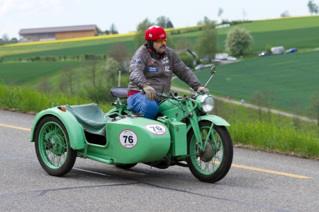 MUTSCHELLEN, SWITZERLAND-APRIL 29: Vintage sidecar motorbike Zündapp KS 600 from 1941 at Grand Prix in Mutschellen, SUI on April 29, 2012.  Invited were vintage sports cars and motorbikes.のeditorial素材