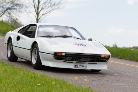 MUTSCHELLEN, SWITZERLAND-APRIL 29: Vintage  car Ferrari 308 GTB from  1977 at Grand Prix in Mutschellen, SUI on April 29, 2012.  Invited were vintage sports cars and motorbikes.のeditorial素材