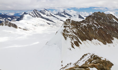Aerial view of alpine mountain panorama  mountain range seen from top of 4,099 m high mount Moench