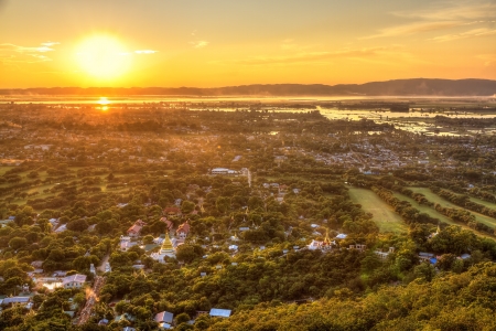 Mandalay with lake mountains, temples and pagodas seen from mandalay hill at sunset, Burmaの写真素材