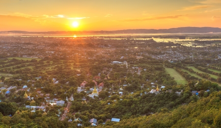 Mandalay with lake mountains, temples and pagodas seen from mandalay hill at sunset, Burmaの写真素材