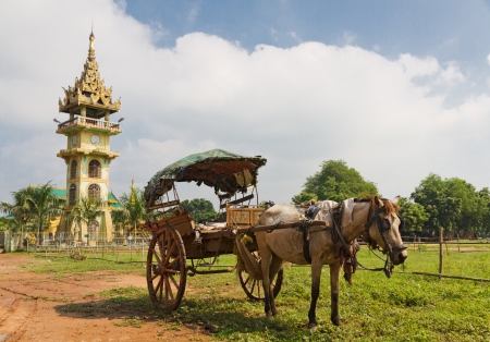 tradiitional burmese horse cart with wooden wheels used for transport and to cart around tourists in front of Paleik snake temple, Burmaの写真素材