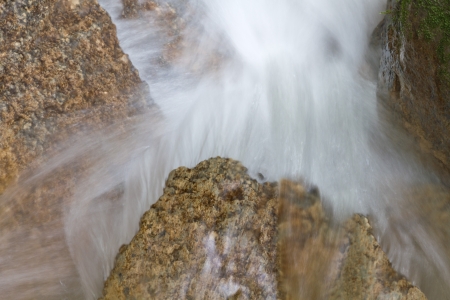 fresh. clean, clear,stream water splash down over stones の写真素材