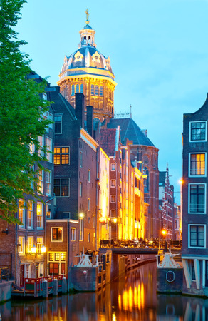 Amsterdam  St  Nicolas Church and Canals at dusk の写真素材