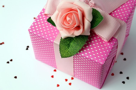 Gift wraped with pink white polka dot paperの写真素材