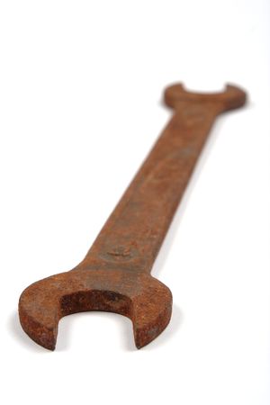 Old rusty spanner isolated on white background.の写真素材