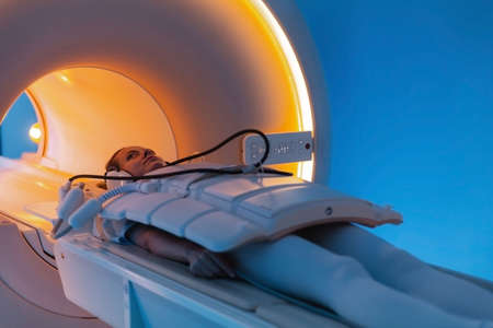 Medical CT or MRI Scan with a patient in the modern hospital laboratory. Interior of radiography department. Technologically advanced equipment in white room. Magnetic resonance diagnostics machineの写真素材
