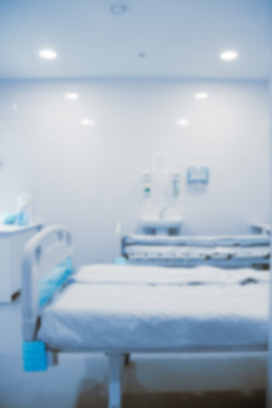 Blurry empty interior operating room and modern equipment in hospital.Medical device for surgeon surgical emergency patient in blue tone style.Save life medical treatment conceptの写真素材