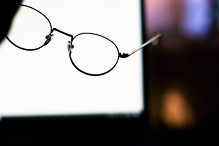 reading glasses - working. computer monitor.の写真素材