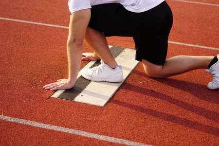 runner starting position. athelte is preparing for the sprint.の写真素材