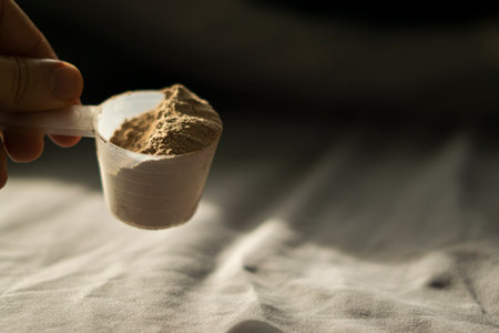 a scoop of chocolate whey proteinの写真素材