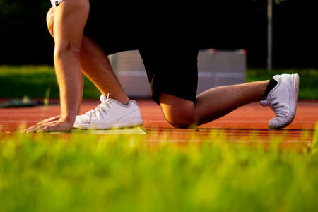 runner starting position. athelte is preparing for the sprint.の写真素材