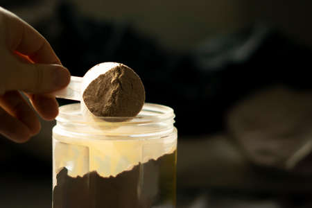 a scoop of chocolate whey proteinの写真素材