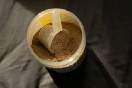 a scoop of chocolate whey proteinの写真素材