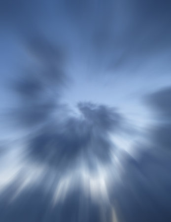 abstract background with rays of light and clouds in the blue skyの写真素材