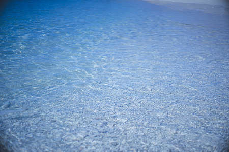 Photo of the sparkling surface of the crystal clear blue sea of Miyakojima, a remote island in Okinawa Prefecture.の写真素材