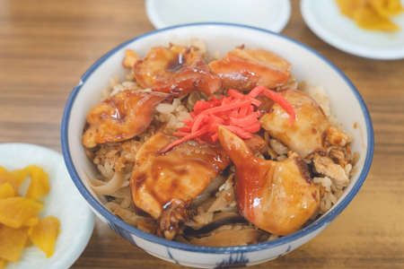 A bowl of rice topped with a Hokkaido Tomakomai specialty, Hokki-donの写真素材
