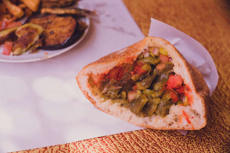 Bread with fried sardines and vegetables at a diner in Tinghir, Morocco.の写真素材