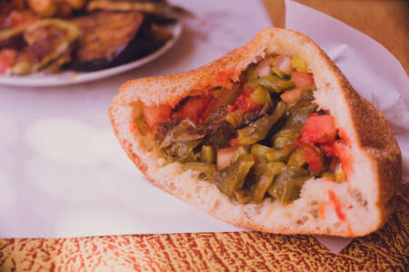 Bread with fried sardines and vegetables at a diner in Tinghir, Morocco.の写真素材