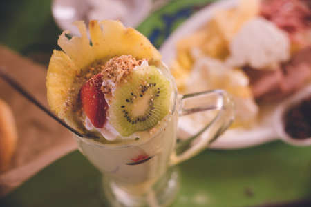 Avocado smoothie with fruit toppings at a diner in the old town of Chefchaouen, a popular tourist destination in Morocco.の写真素材
