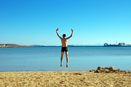 Jumping on the beach, Antiparos, Greeceの写真素材