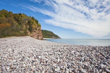 Stony beach on the Fundy Trail along the Bay of Fundy in New Brunswick.の写真素材