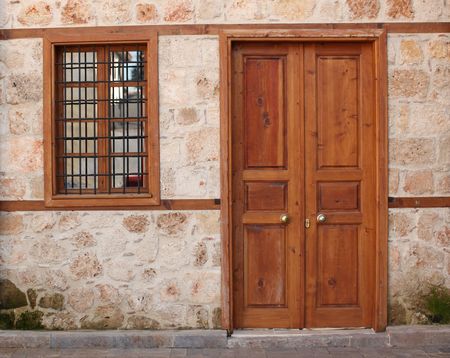 Old door and window and ancient wall in Turkeyの写真素材