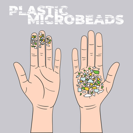 Micro beads on the palm. Microplastics from mismanaged plastic waste. Marine and ocean plastic...