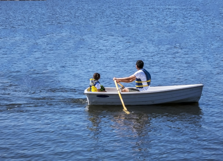 This is an image of a father and son outing at a local lake. Image was taken at Shoreline park lake in Mountain View, California.の写真素材