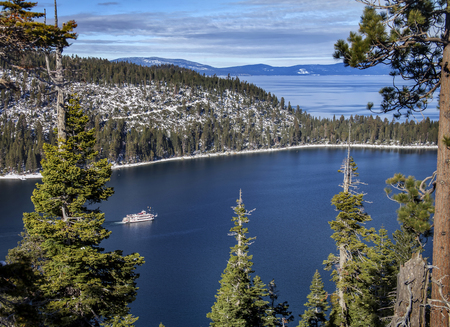 An image of the Tahoe Queen paddle wheel cruise ship on a winter excursion in Lake Tahoe's Emerald Bay.の写真素材