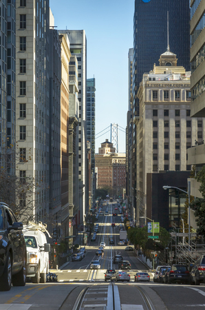 An image looking down Kerney Avenue towards Market Street in downtown San Francisco, California. Bay Bridge towers in the background.のeditorial素材