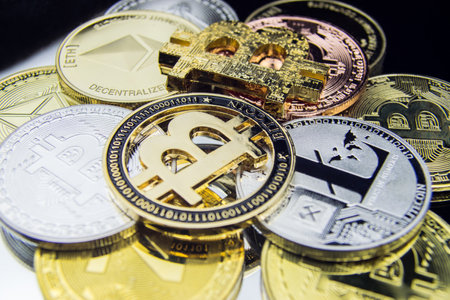 BITCOINS on a reflective surface Cryptocurrency background  Ethereum Litecoin Zcash Bitcoin coins digital.の写真素材