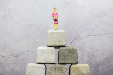Woman female victory Woman standing on top of concrete blocks