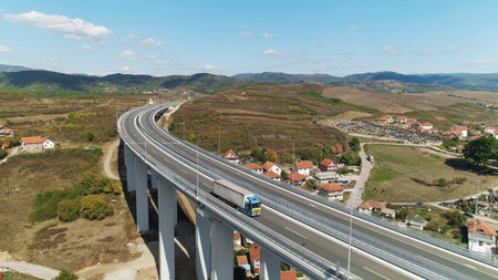 Viaduct traffic truck Drone shot sunny day blue sky. Aerial view of the road in Serbia